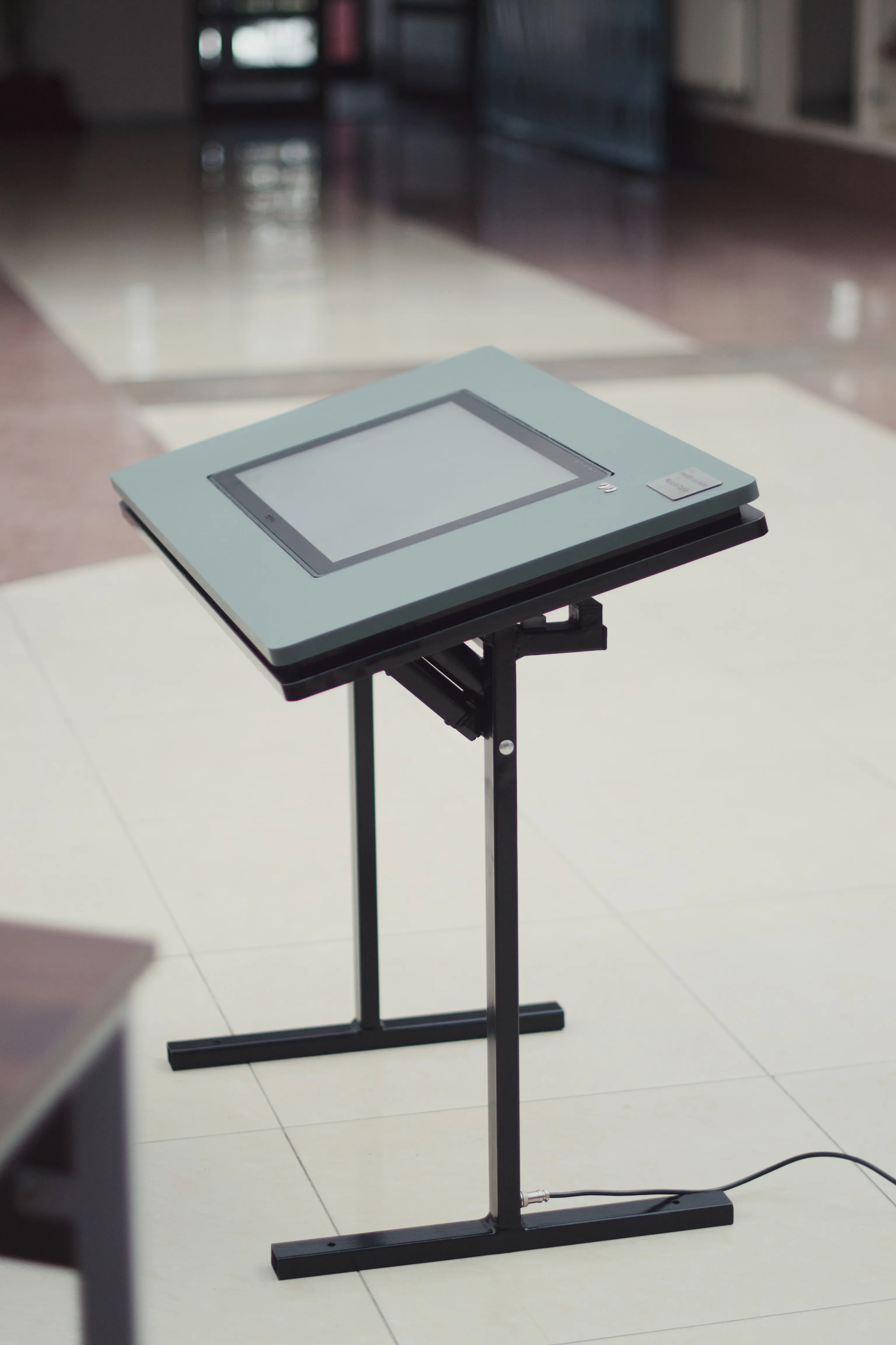 Student writing on NoteX Table