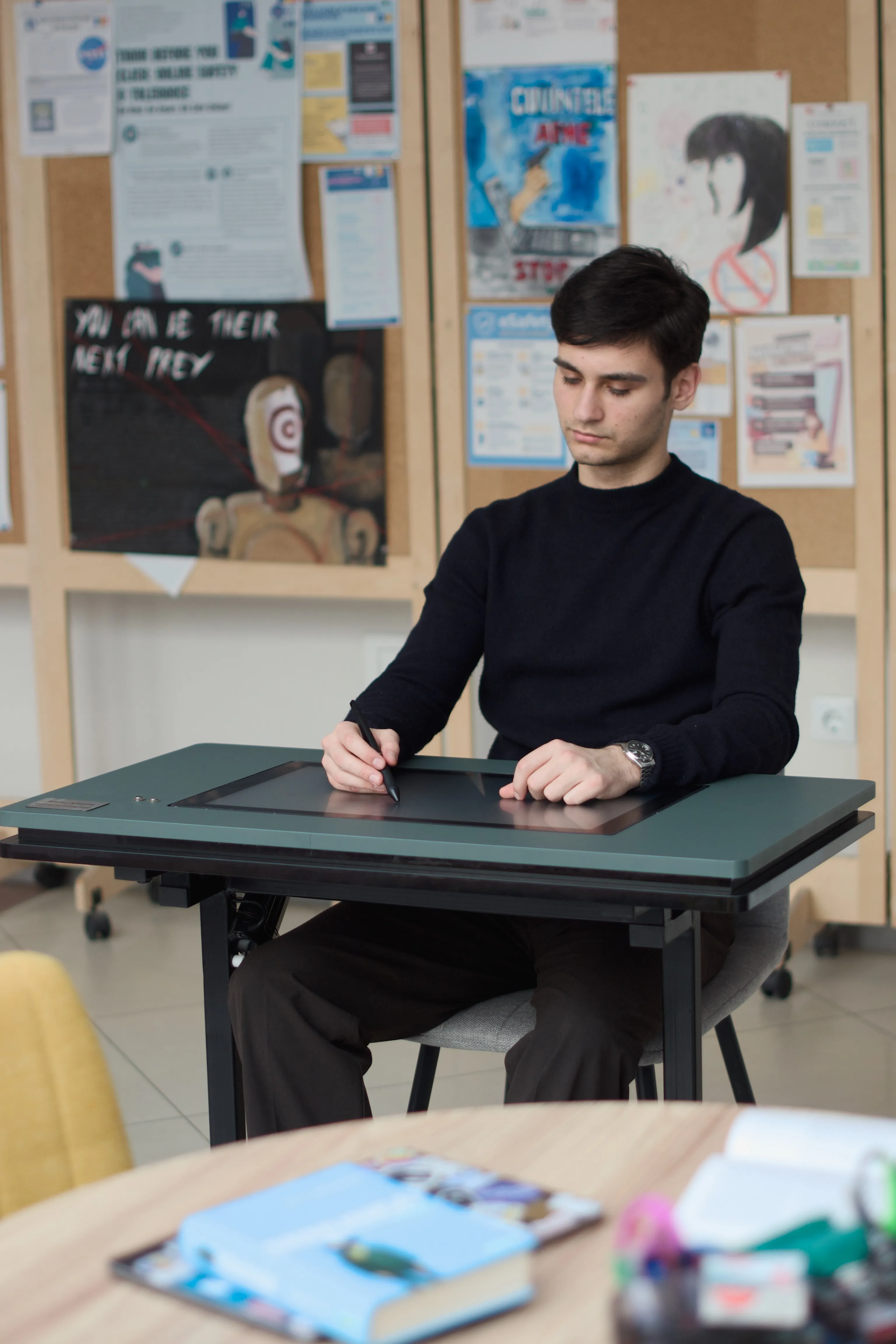 NoteX Table - Student writing — front view